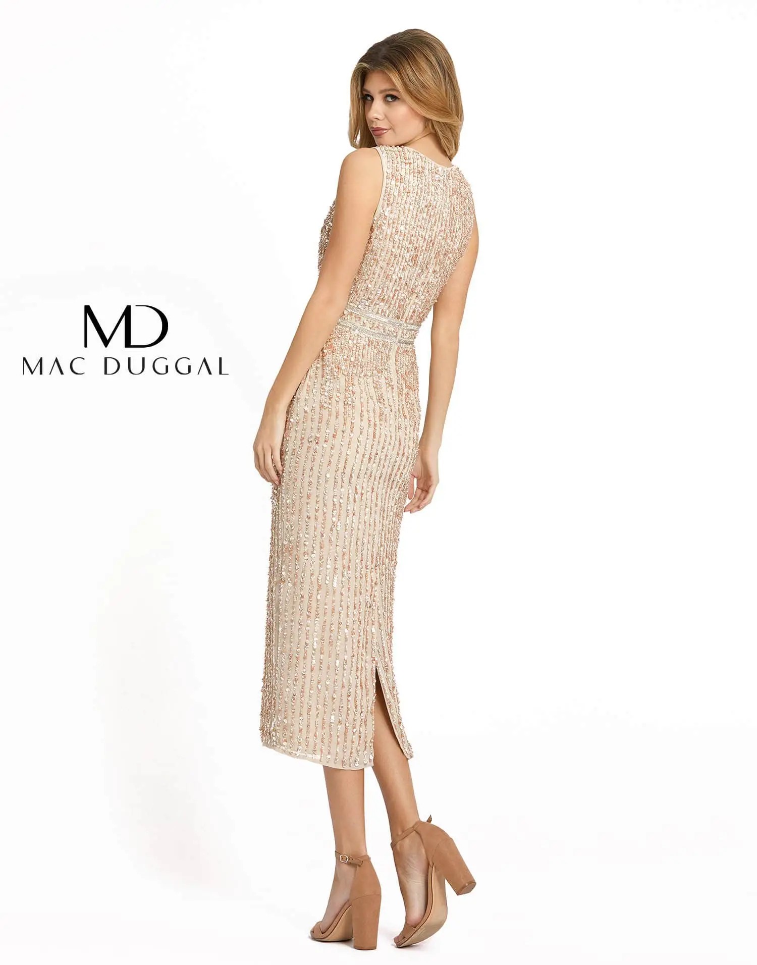 Model is wearing a gold shimmery sleeveless cocktail dress