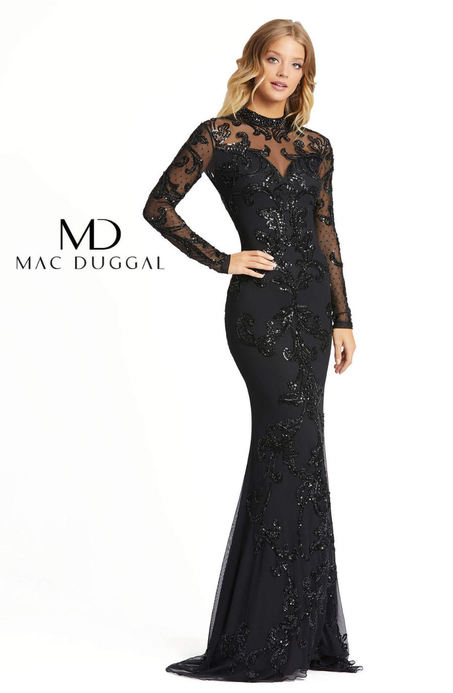 Model is wearing a long sleeve lace floor length black evening gown
