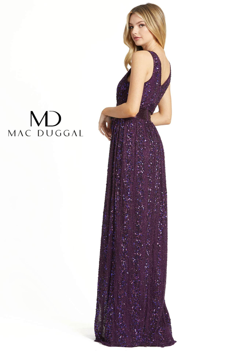 Model is wearing a sleeveless purple glittery evening gown with a v-neckline